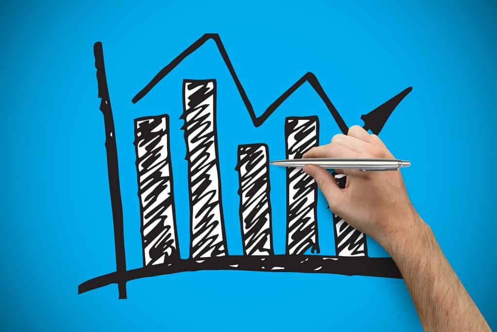 Gráfica de barras y línea en color negro sobre fondo azul, representando estadísticas financieras o crecimiento económico. Representa el potencial de la plata como vehículo de inversión en 2026.